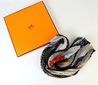 an orange box with a black and white scarf and a black and white scarf