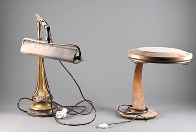 two lamps that are sitting next to each other on a table