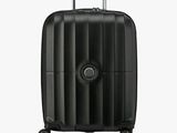the black suitcase is sitting on wheels on a white surface