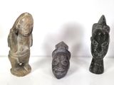 three different types of statues are displayed on a white surface