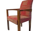 a wooden chair with a red upholstered upholstered upholstered seat