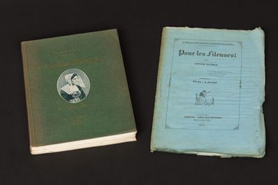 an old book with a picture of a woman on it next to an old book with a picture of a woman on it