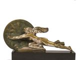 bronze sculpture of a woman holding a ball on a marble base
