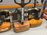a lot of different types of forklifts on the floor