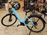 a blue bicycle that is parked in a store