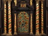 a large ornate clock on display in the middle of a room