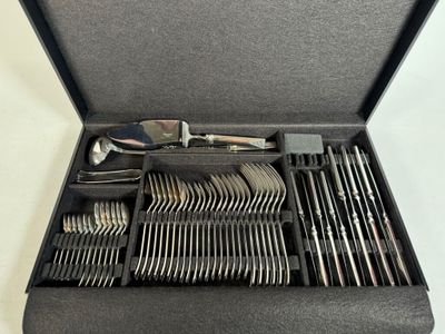 silverware in a black case on a white table
