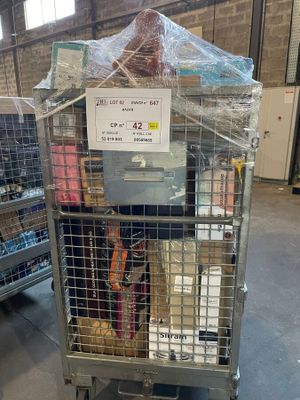 a cage with a bunch of items inside of it