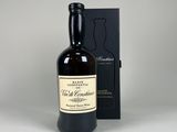 an empty bottle of whisky sitting next to a black box