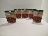 quatre sachets de produits frais sont posés sur un plan de travail blanc