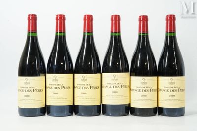 six bottles of wine are lined up on a white surface