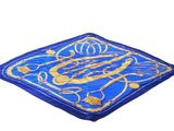 a close up of a blue and gold square with a design on it