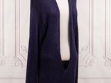 a close up of a mannequin mannequin wearing a purple cardigan
