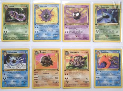 several pokemon cards are lined up in a row on a table