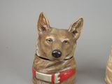 two salt and pepper shakers with a dog on them