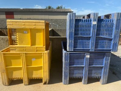 three yellow and blue plastic crates stacked on top of each other