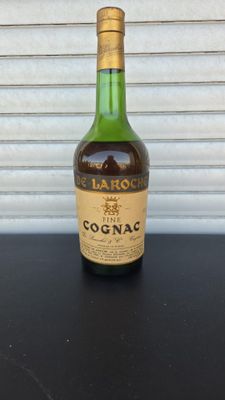 a close up of a bottle of cognac on a table