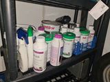 a shelf with many different types of cleaning products on it