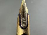 a close up view of a pencil with a hole in it