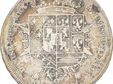 an old silver coin with a coat of arms on it