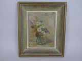 un tableau de fleurs dans un vase sur le mur