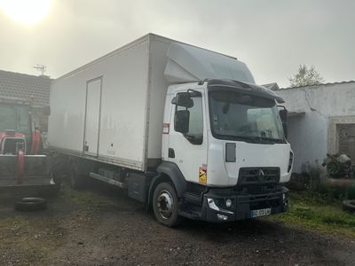 a truck that is parked next to a building