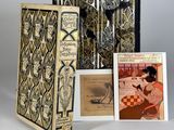 a collection of books, including a picture of a woman sitting on a bench
