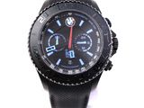 black and blue watch on a white background with a red second hand