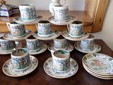 a lot of cups and saucers on the table