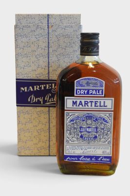 the bottle of dry pale is next to a cardboard box