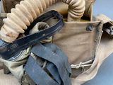 a bag that has a knife and other items in it