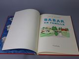 an open book with a picture of a farm on it