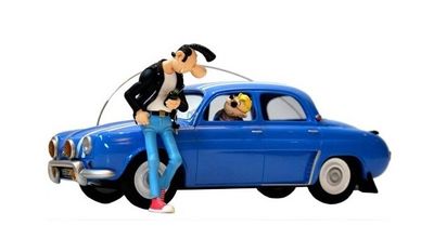 a figurine of a man and a dog sitting on a car