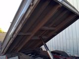 a truck that has a flat bed on the back of it