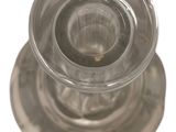 a clear glass candle holder on a white background