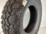 tires on a shelf in a room with a white wall