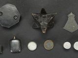 an image of a collection of metal objects on a black surface
