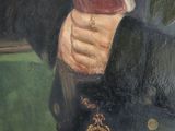 portrait of a man in military uniform holding a book in his right hand