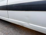 a white car parked on the side of the road