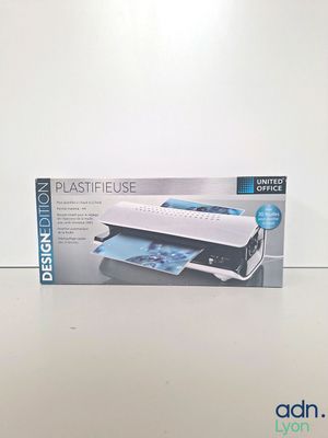 an open box of a printer sitting on top of a white table