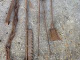 a lot of rusty tools that are on the ground