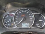 a close up of a car dashboard with a speedometer and gauges