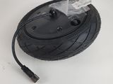 a close up of a tire with a cable connected to it