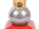 a shiny silver ball with a gold crown on top