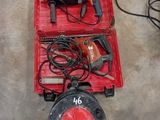 two tools in a red box on the floor