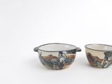 two bowls that are sitting side by side on a white surface