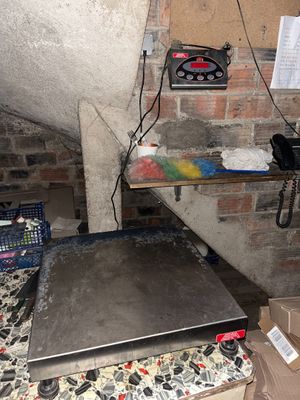 a laptop computer sitting on top of a table in a room