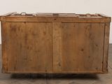 an old wooden chest sitting on top of a hard wood floor