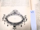un livre ouvert sur lequel figure l'image d'un miroir