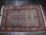 an oriental rug on the floor in a living room